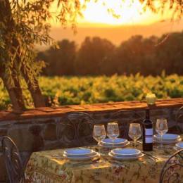 Outdoor table with vineyard background in susnet time in tuscany italy